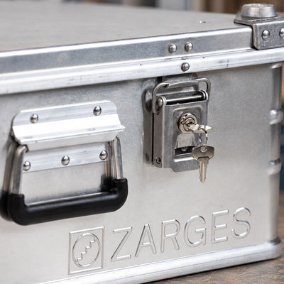 ZARGES 40832 lock fitted to an aluminium case with the key inserted